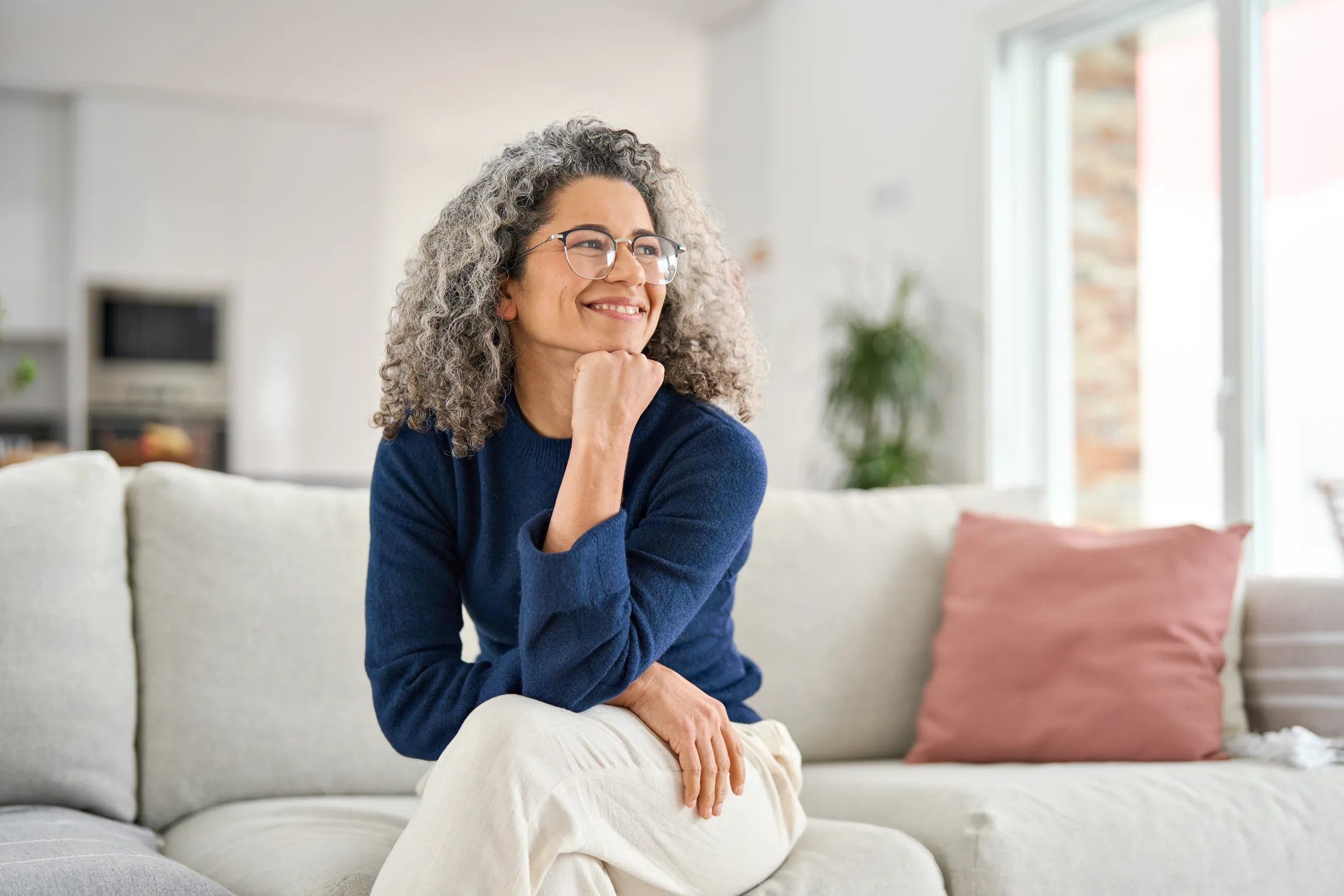 Smiling woman in a comfortable home setting