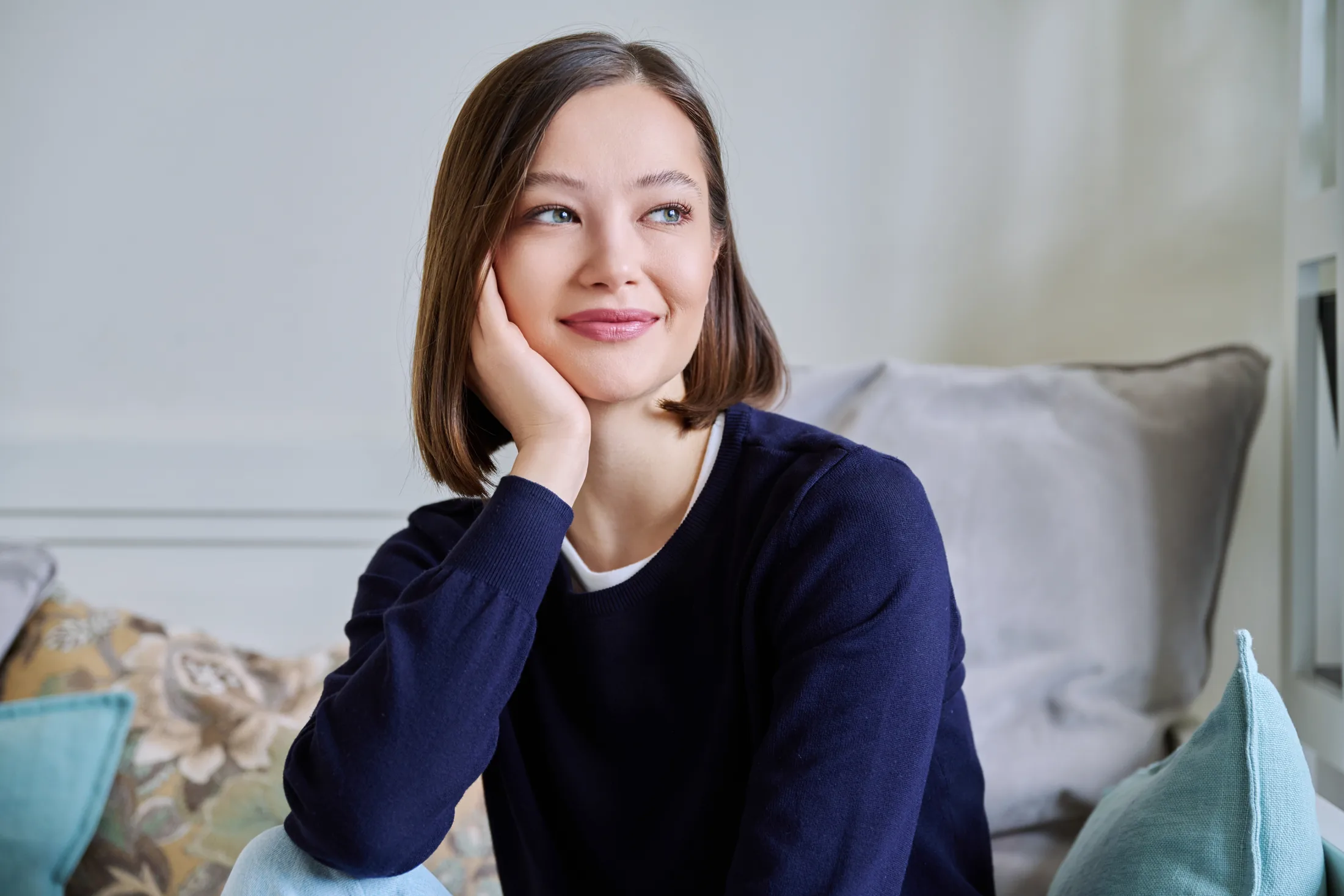 Young woman smiling in a comfortable office setting